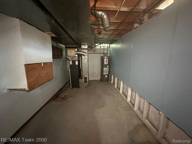 30600 Fort Road Rockwood, MI 48173 - Photo 22 of 28 Concrete floor basement with exposed ceiling joists and ductwork