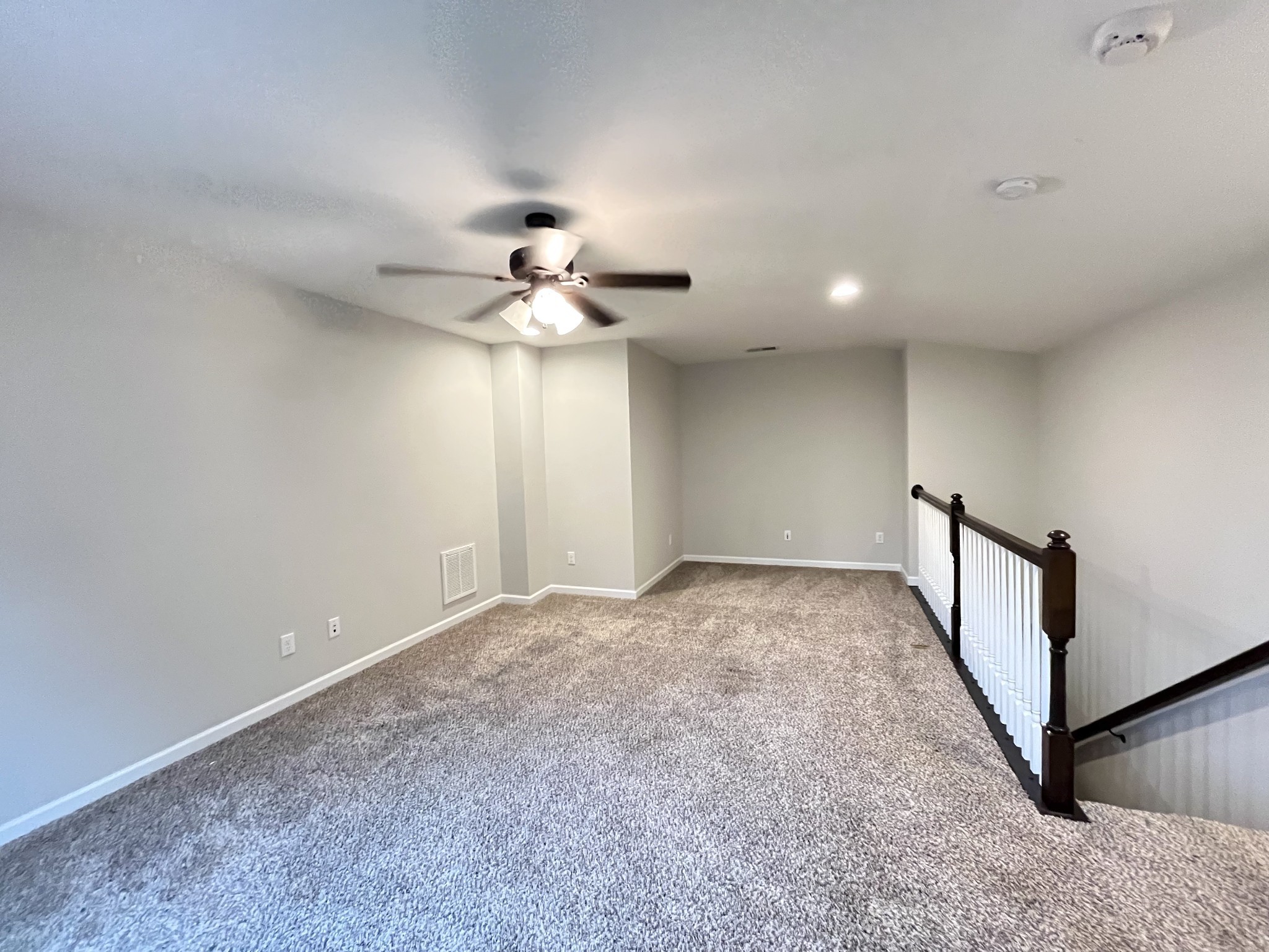 2817 Bluestem Lane Murfreesboro, TN 37128 - Photo 13 of 33 a view of an empty room with a chandelier fan