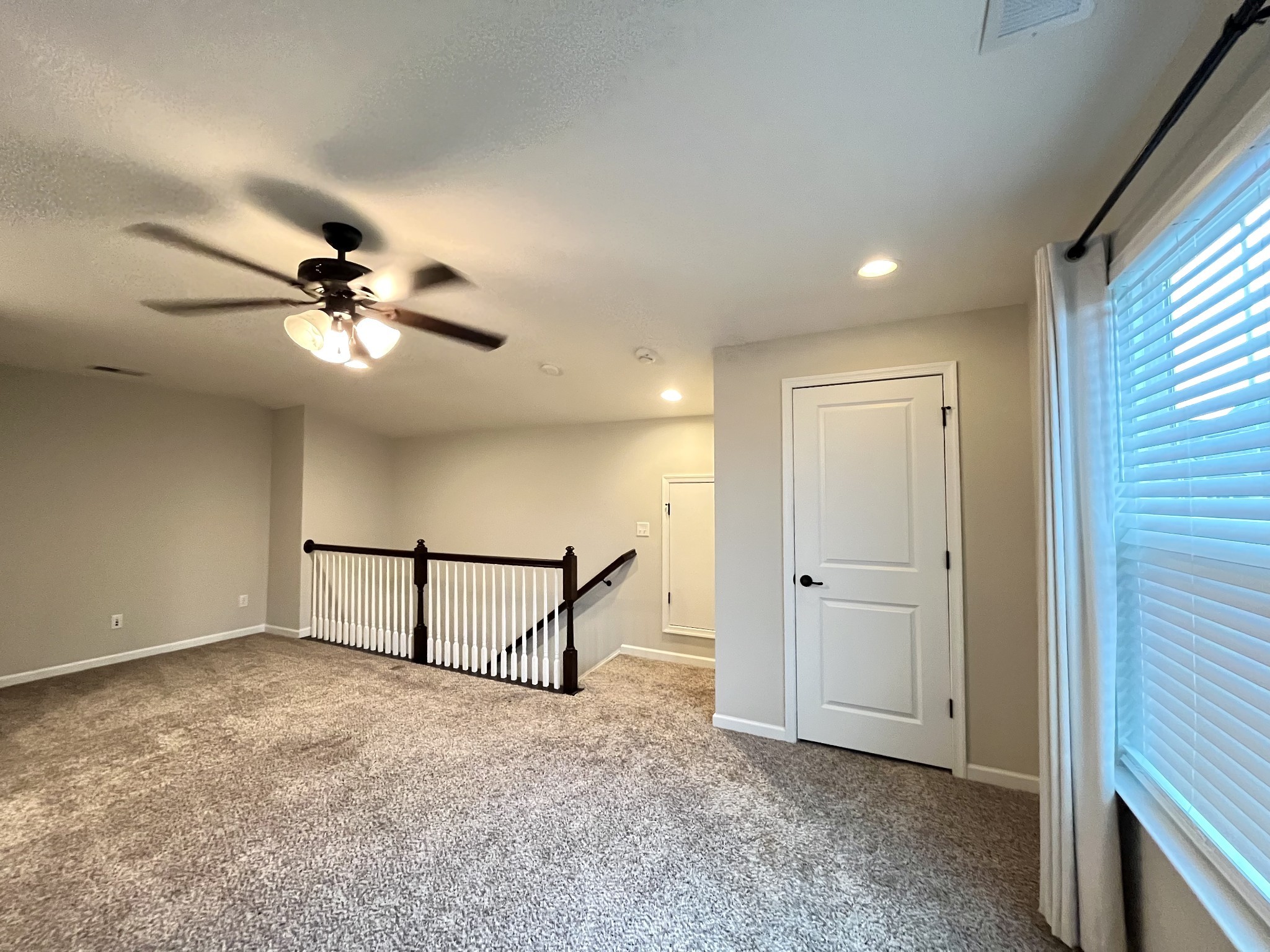 2817 Bluestem Lane Murfreesboro, TN 37128 - Photo 14 of 33 wooden floor in an empty room with a window