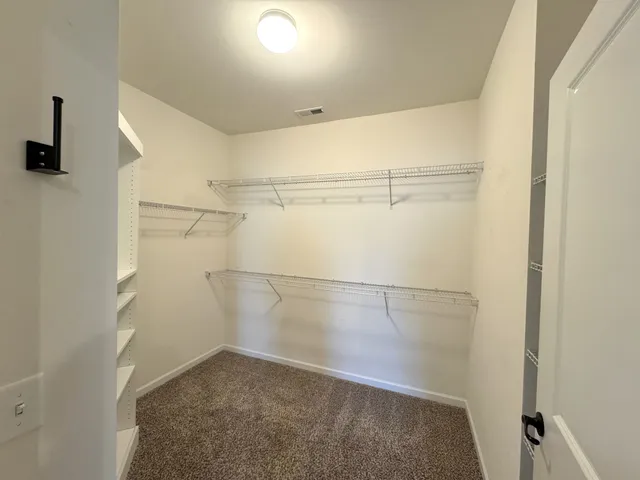 a view of a room with racks on the wall