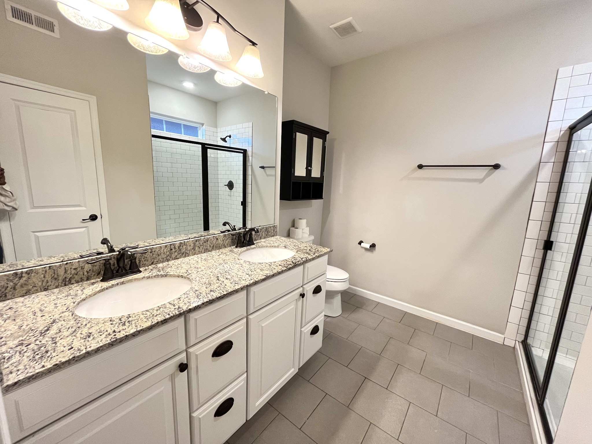 2817 Bluestem Lane Murfreesboro, TN 37128 - Photo 24 of 33 a bathroom with a granite countertop sink a mirror and a