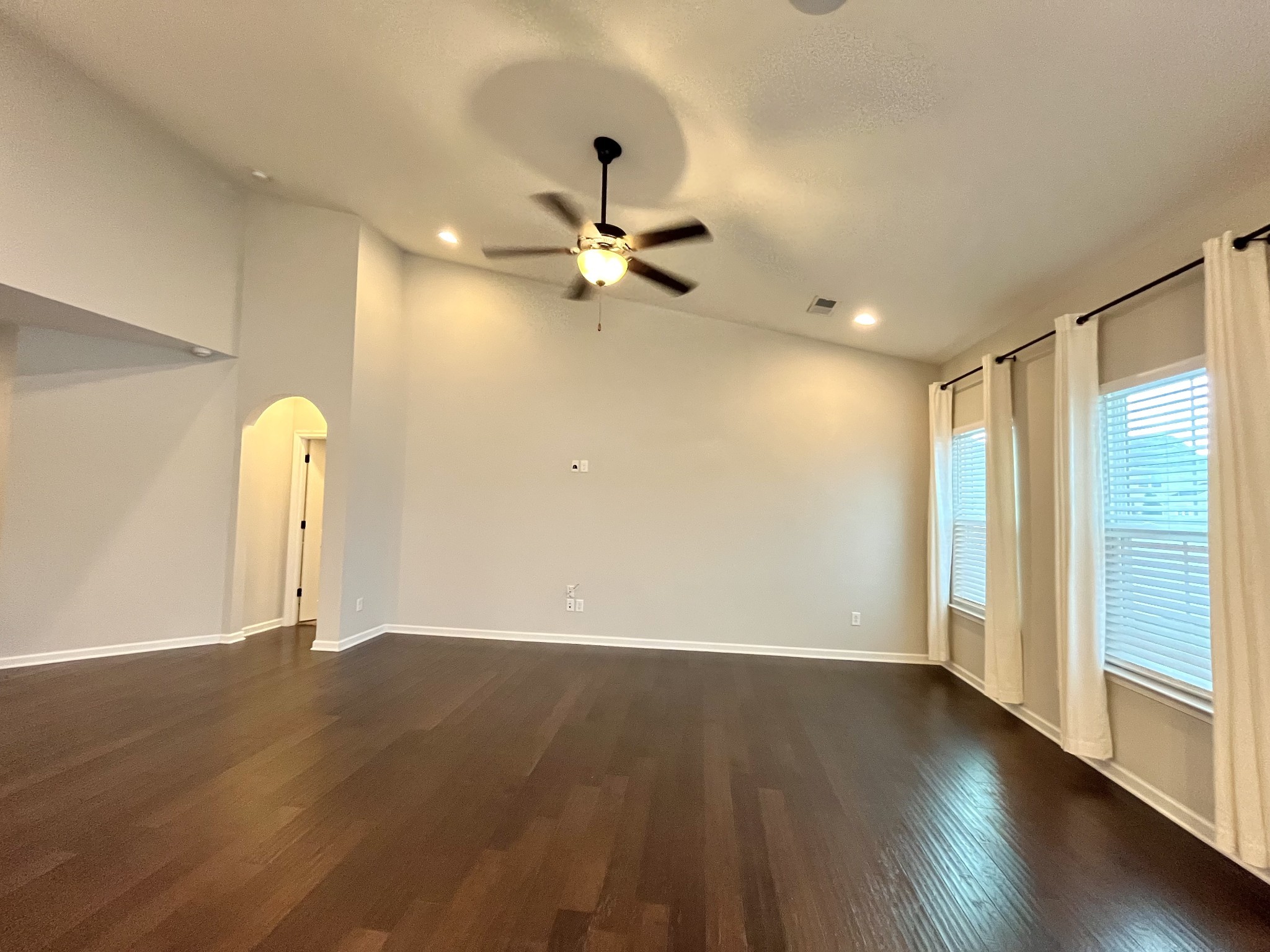 2817 Bluestem Lane Murfreesboro, TN 37128 - Photo 4 of 33 a view of a room with wooden floor and a ceiling fan
