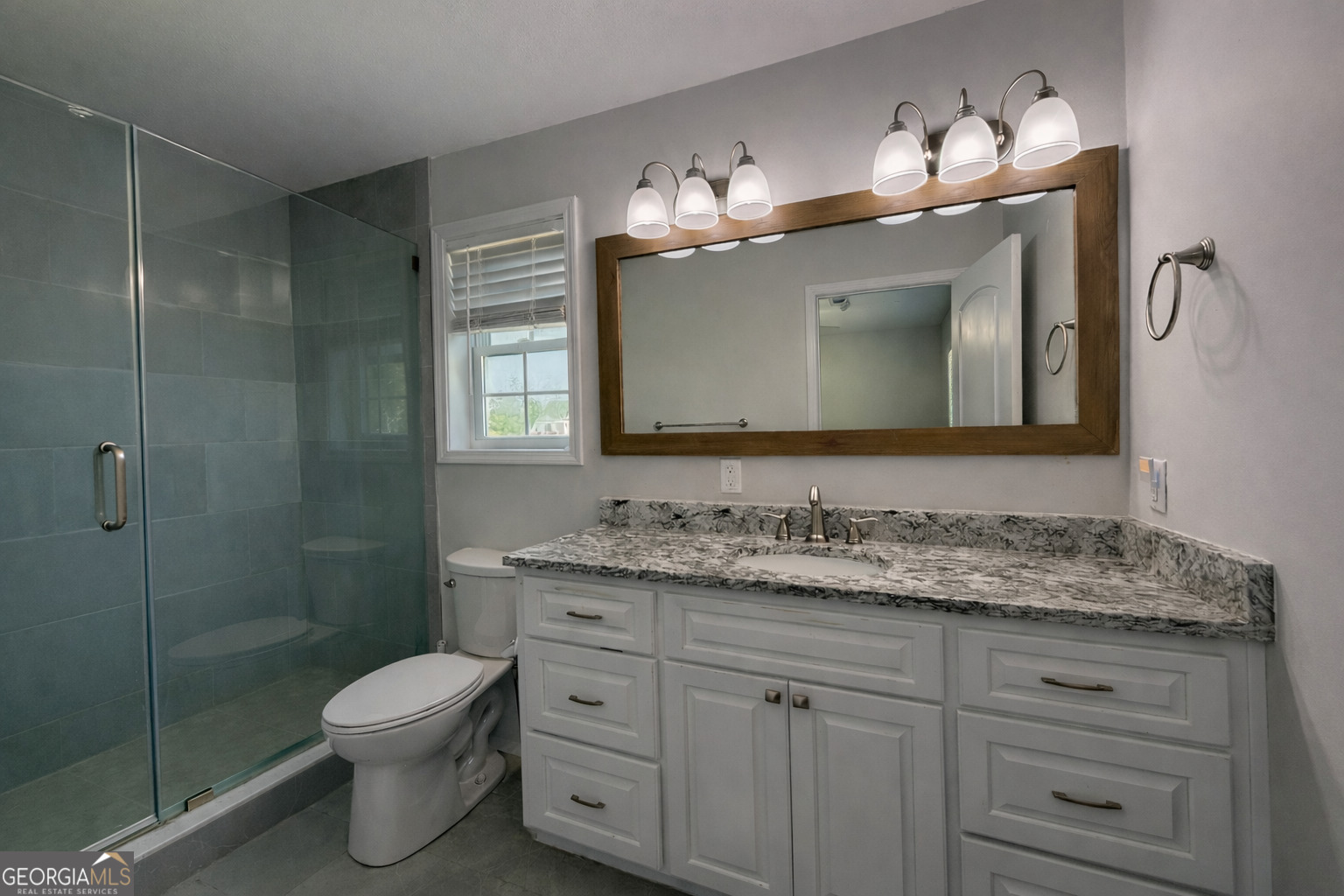 365 Quail Lane Alston, GA 30473 - Photo 5 of 9 a bathroom with a toilet sink and mirror