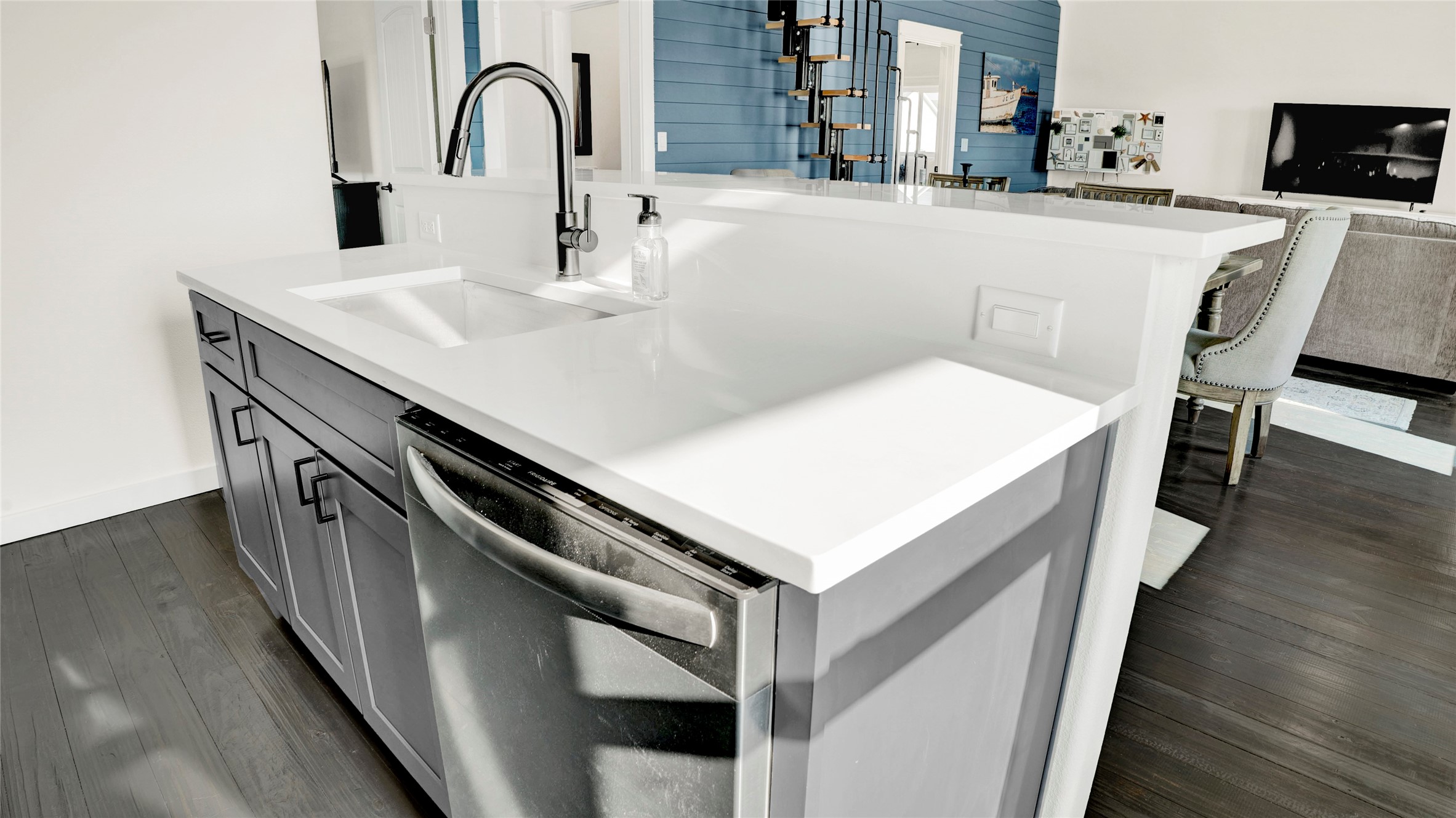 1065 Sunset Circle Crystal Beach, TX 77650 - Photo 24 of 50 a kitchen with a sink a stove and wooden floor