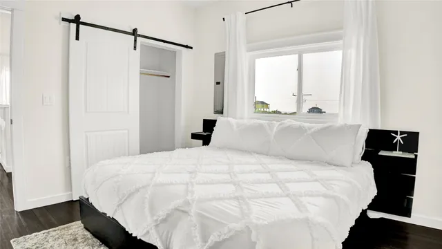 a large white bed in a white room