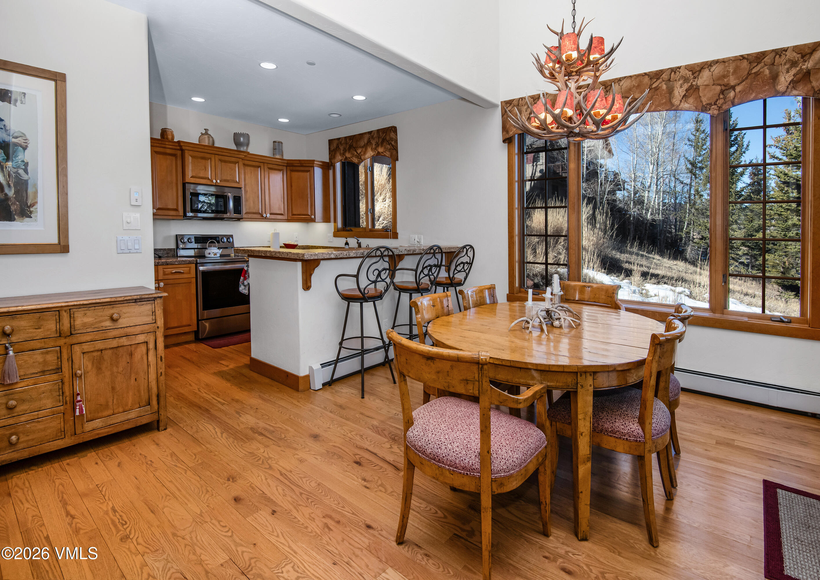 181 Club Cottage Drive Edwards, CO 81632 - Photo 11 of 34 a kitchen with a table and chairs in it