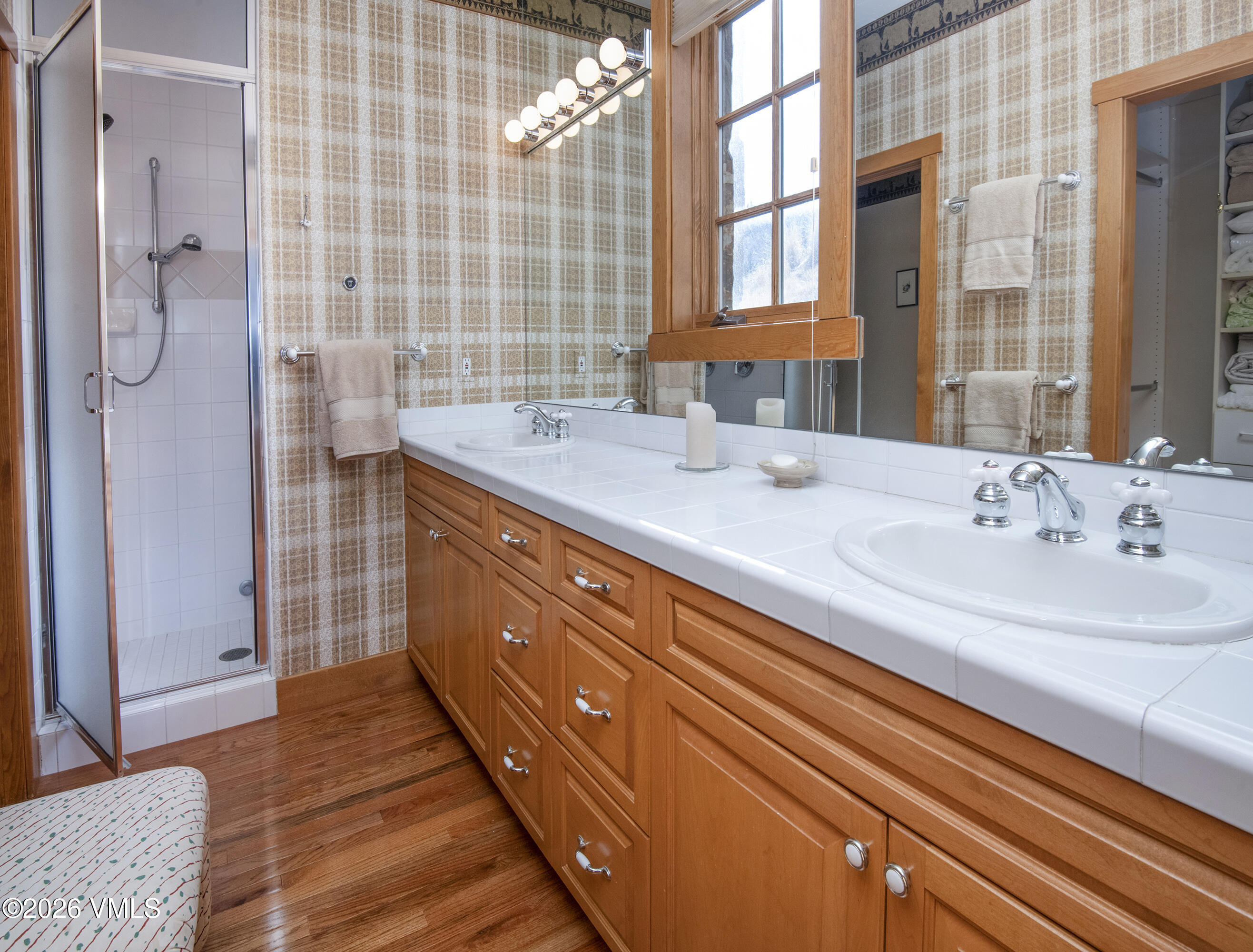 181 Club Cottage Drive Edwards, CO 81632 - Photo 16 of 34 a bathroom with a double vanity sink a two mirror and a shower