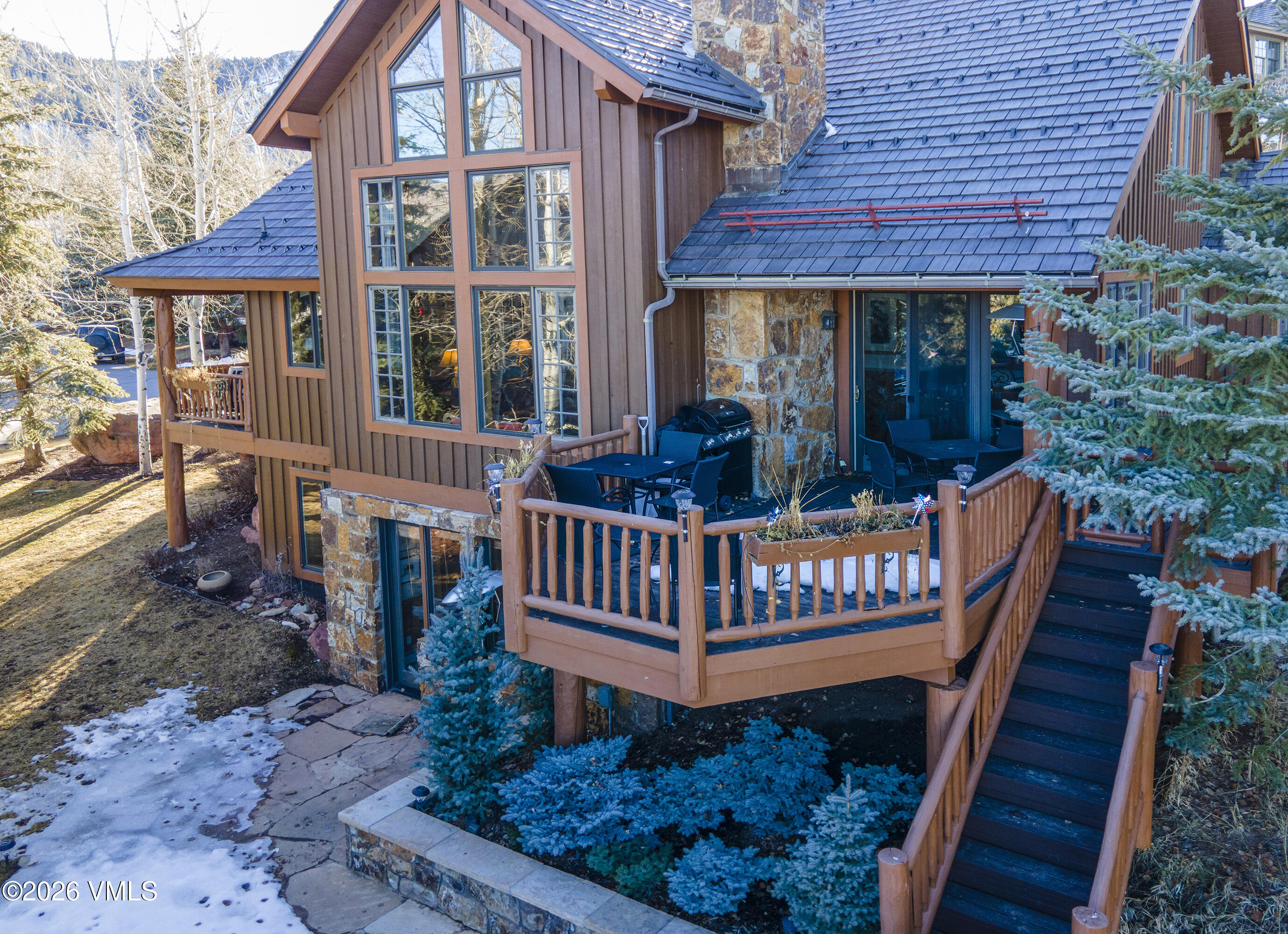 181 Club Cottage Drive Edwards, CO 81632 - Photo 2 of 34 a view of a brick house with a deck and furniture
