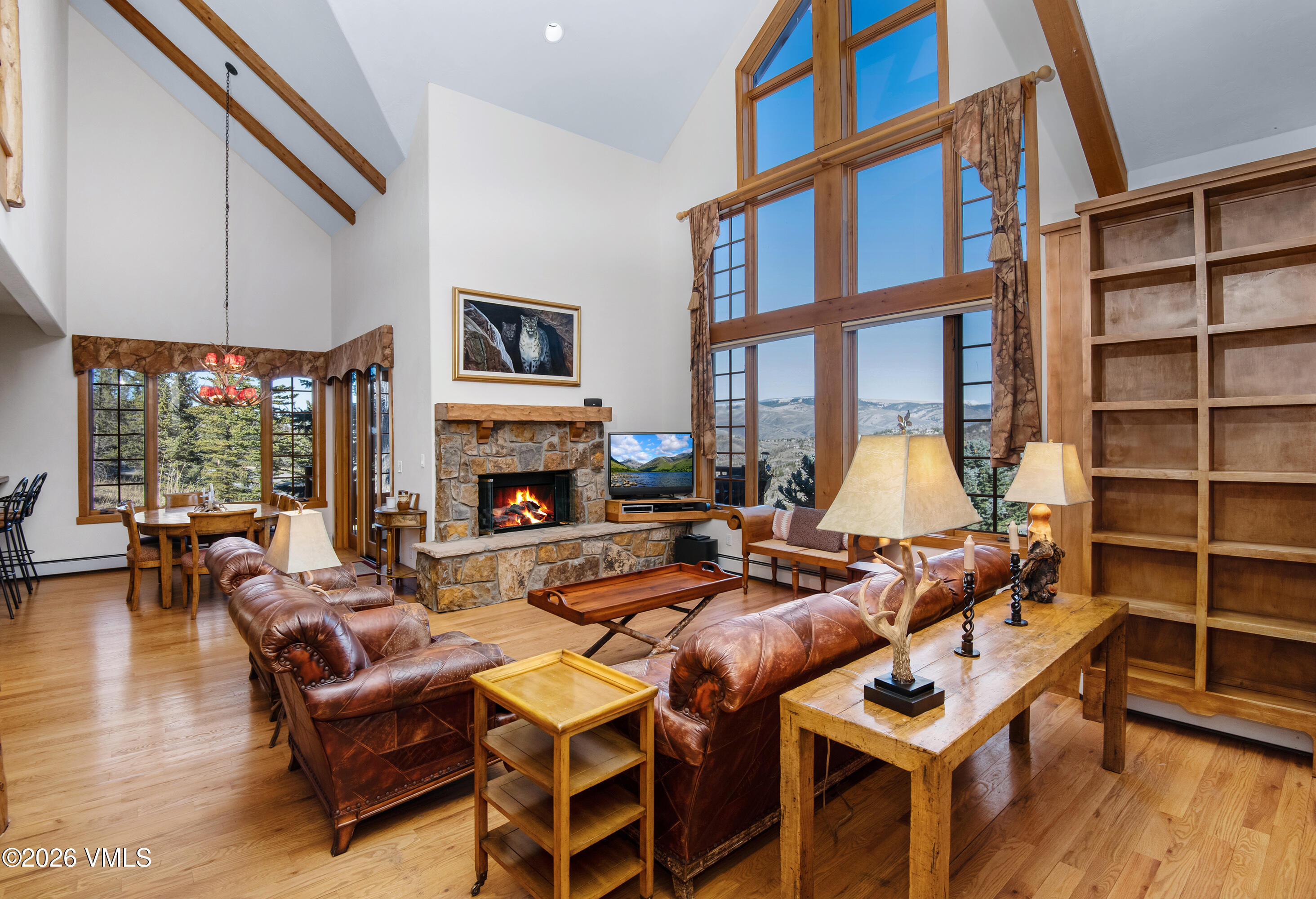 181 Club Cottage Drive Edwards, CO 81632 - Photo 4 of 34 a living room with furniture a fireplace and a floor to ceiling window