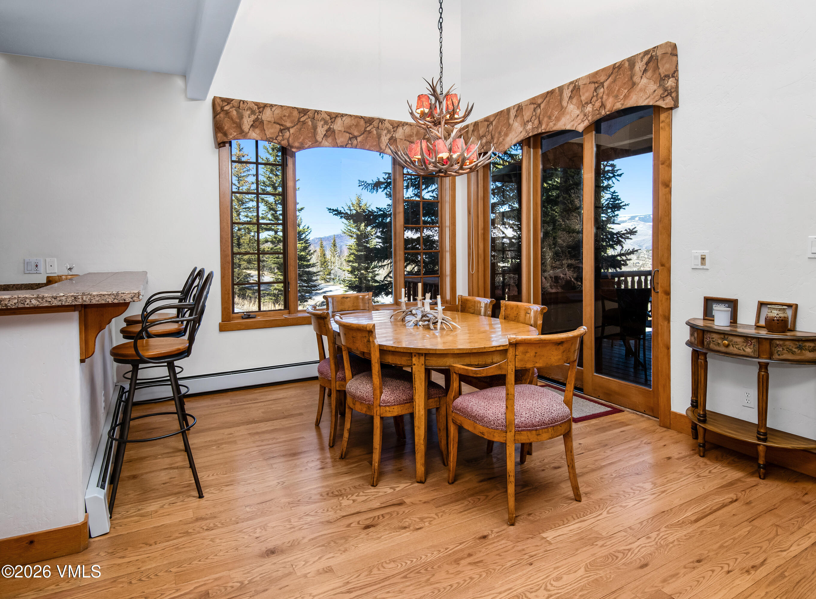 181 Club Cottage Drive Edwards, CO 81632 - Photo 10 of 34 a dining room with furniture and wooden floor