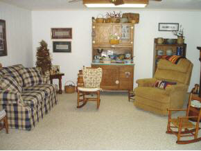 3945 Rockfish Road Grottoes, VA 24441 - Photo 5 of 7 a living room with furniture and a chandelier