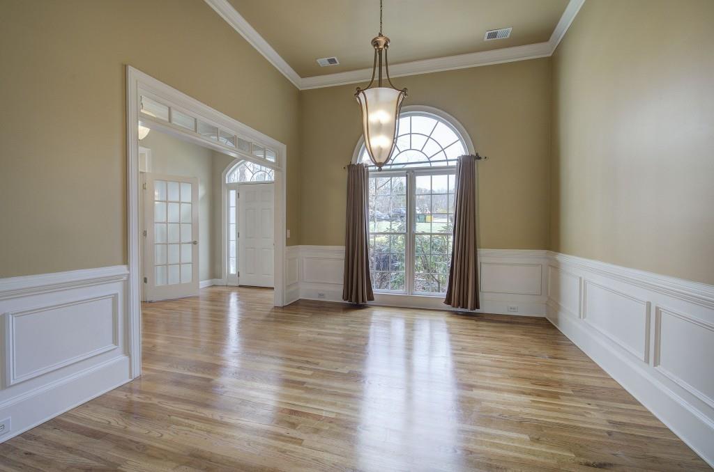 302 Waterfall Court Canton, GA 30115 - Photo 11 of 80 wooden floor in an empty room with a window