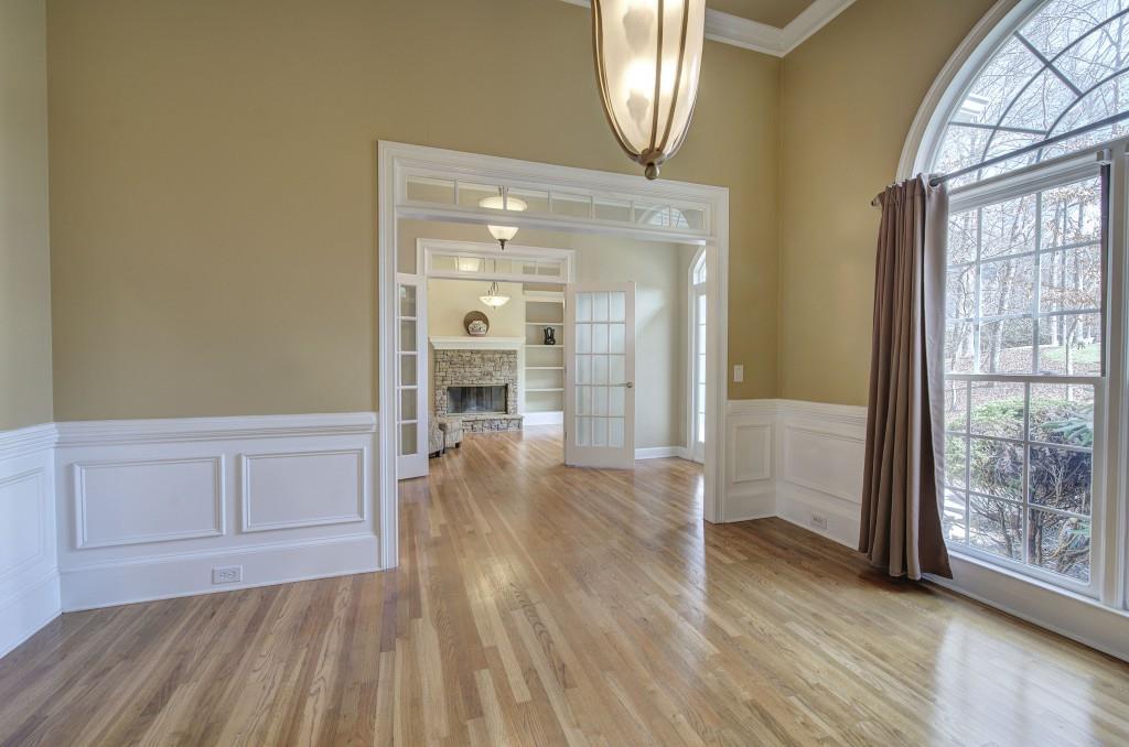 302 Waterfall Court Canton, GA 30115 - Photo 12 of 80 a view of empty room with wooden floor and fan