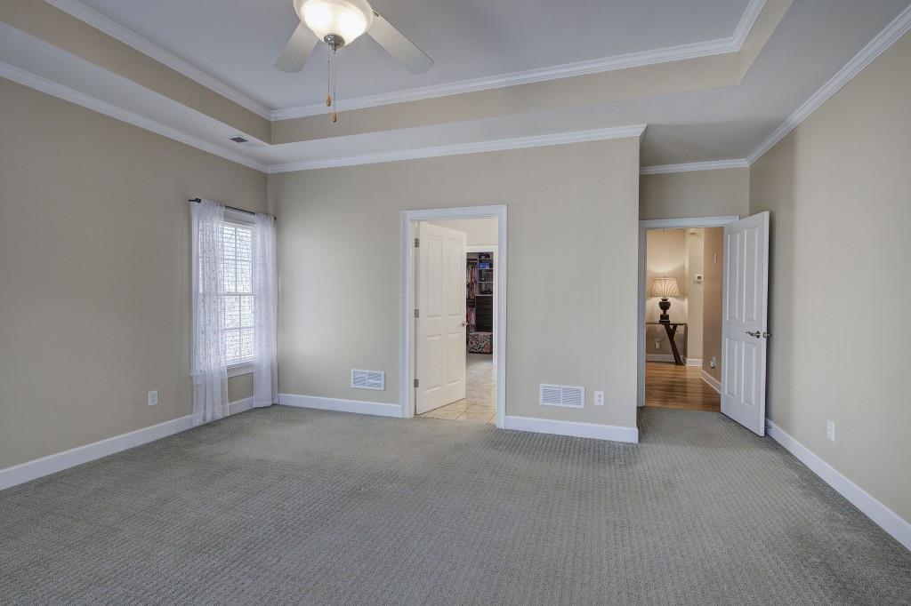 302 Waterfall Court Canton, GA 30115 - Photo 19 of 80 a view of empty room with a ceiling fan
