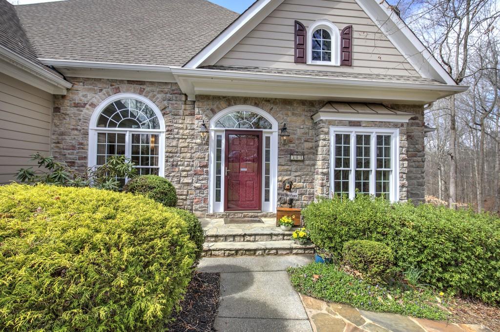 302 Waterfall Court Canton, GA 30115 - Photo 2 of 80 a front view of a house with a yard