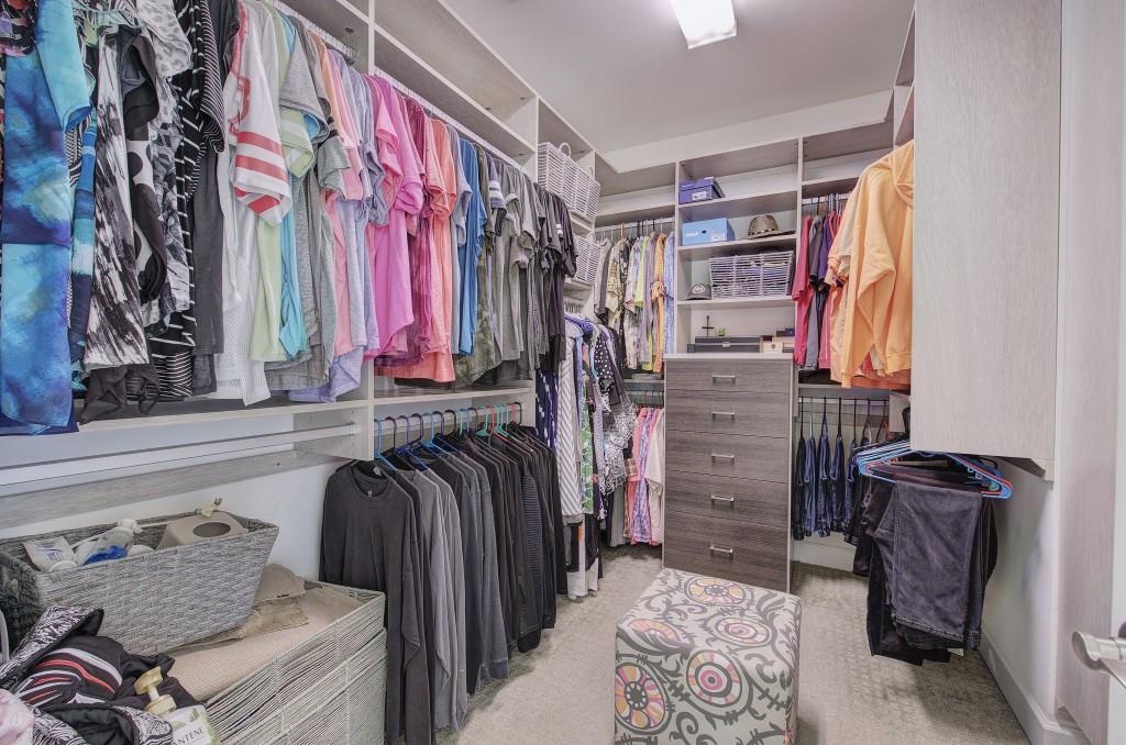 302 Waterfall Court Canton, GA 30115 - Photo 23 of 80 a view of walk in closet with clothes and shoes