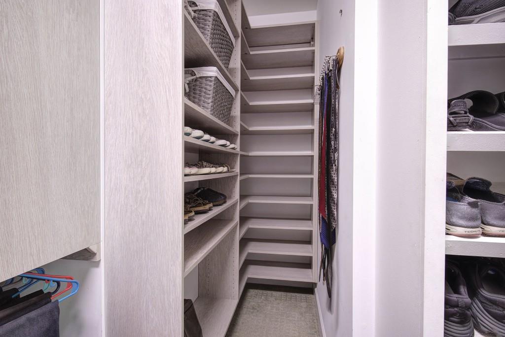 302 Waterfall Court Canton, GA 30115 - Photo 24 of 80 a view of walk in closet with clothes and shoes