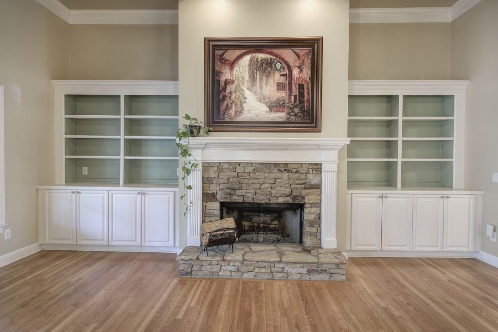302 Waterfall Court Canton, GA 30115 - Photo 25 of 80 a view of a livingroom with furniture and a fireplace