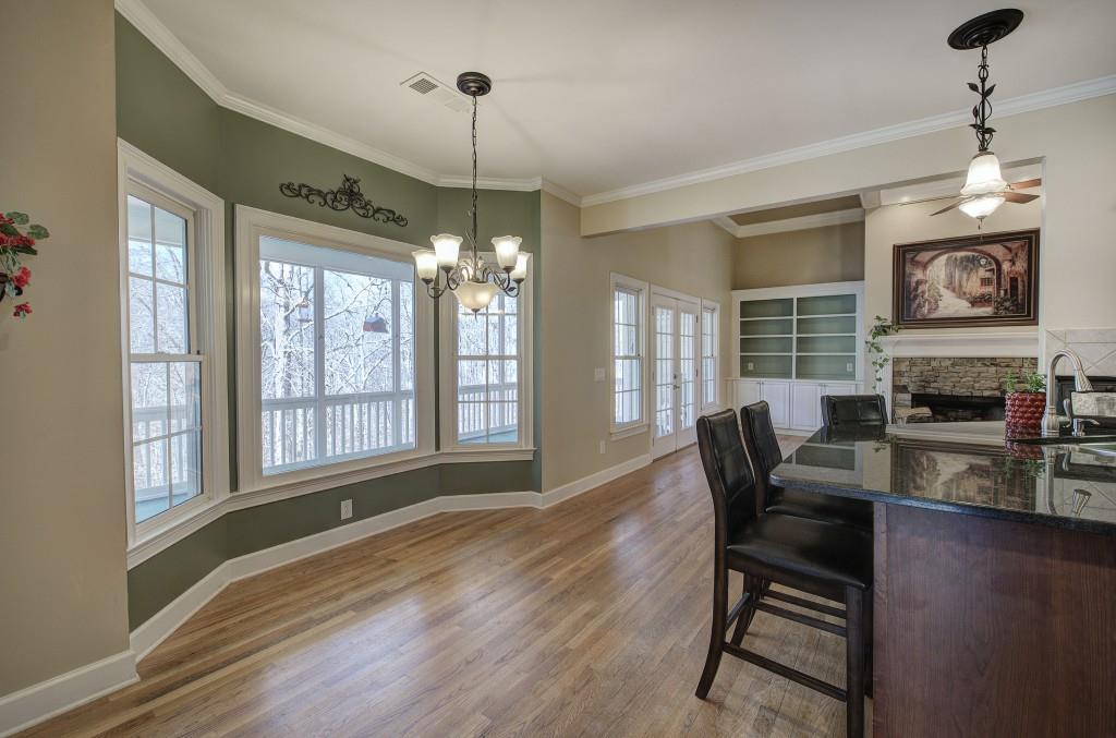 302 Waterfall Court Canton, GA 30115 - Photo 28 of 80 a view of a dining room with furniture window and wooden floor