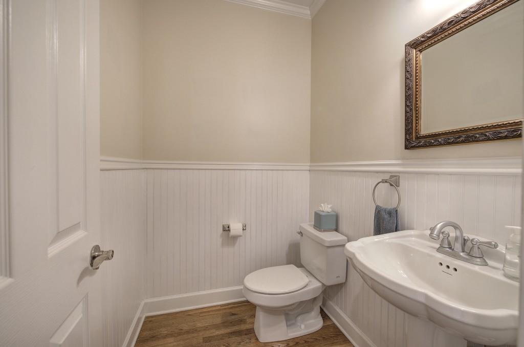 302 Waterfall Court Canton, GA 30115 - Photo 33 of 80 a bathroom with a toilet a sink and mirror