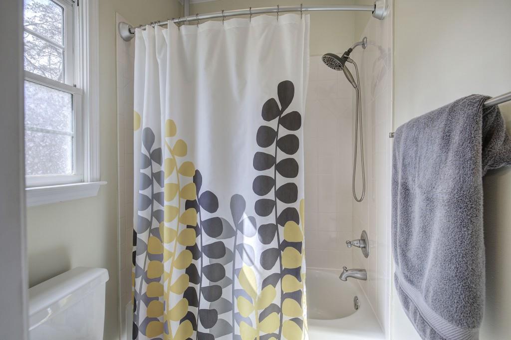 302 Waterfall Court Canton, GA 30115 - Photo 36 of 80 a bathroom with a shower curtain and a shower curtain