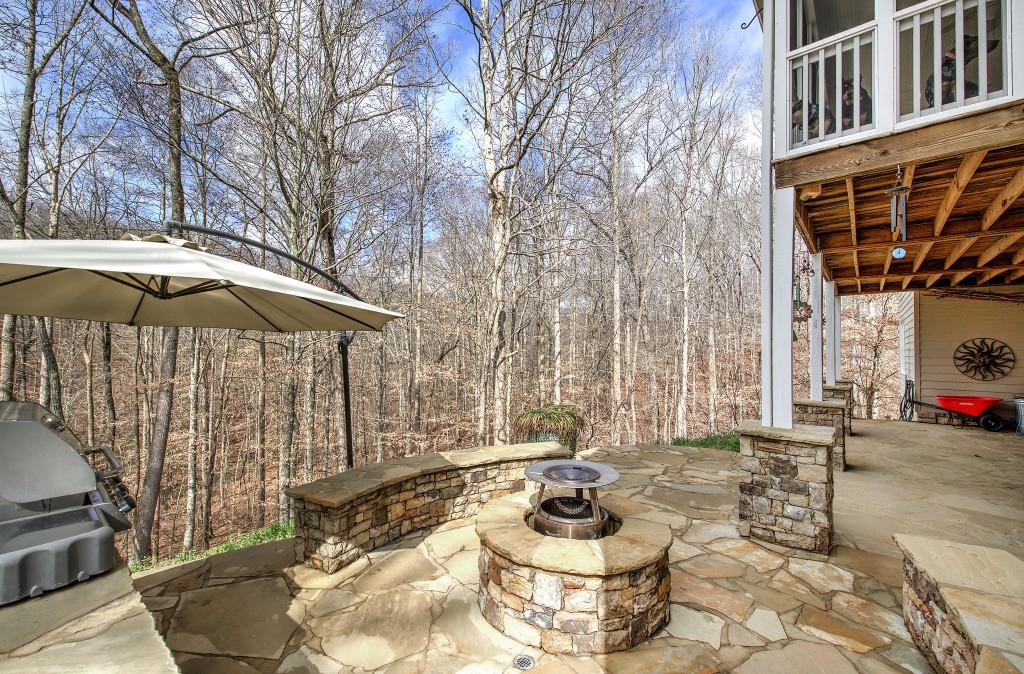 302 Waterfall Court Canton, GA 30115 - Photo 51 of 80 a patio with a table and chairs