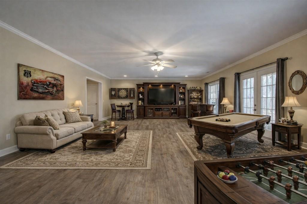 302 Waterfall Court Canton, GA 30115 - Photo 57 of 80 a living room with furniture and wooden floor
