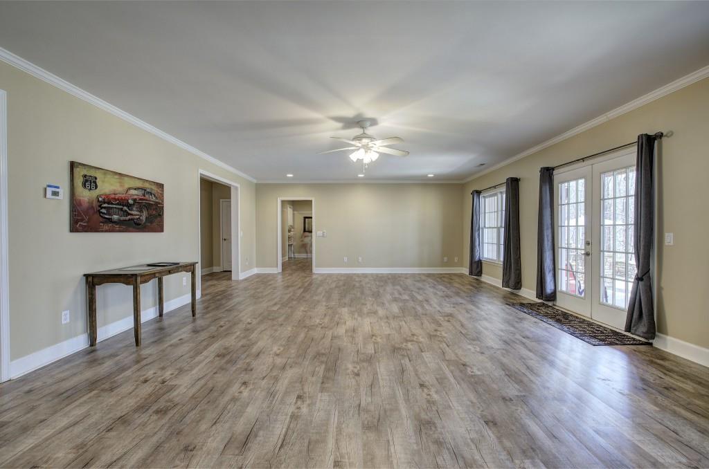 302 Waterfall Court Canton, GA 30115 - Photo 58 of 80 a view of an empty room with a window and wooden floor