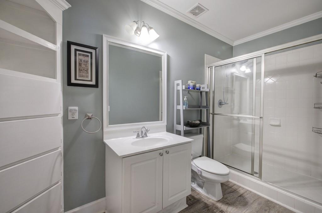 302 Waterfall Court Canton, GA 30115 - Photo 64 of 80 a bathroom with a toilet sink and shower