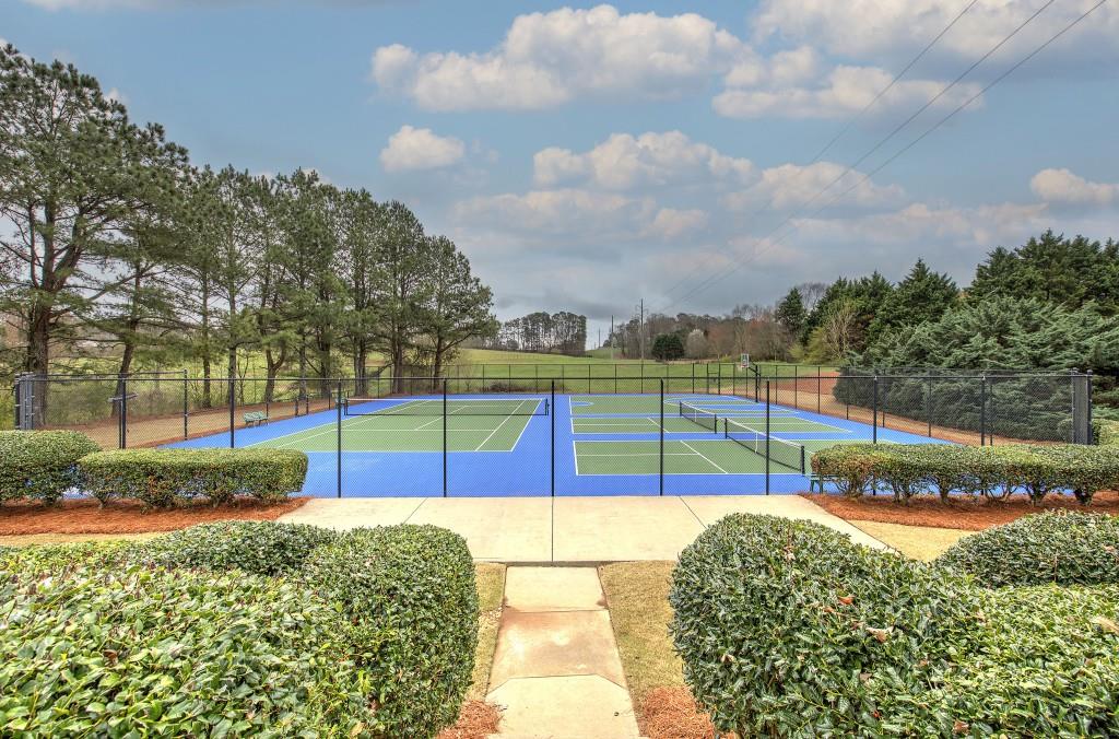 302 Waterfall Court Canton, GA 30115 - Photo 77 of 80 a view of a swimming pool with a patio and a yard