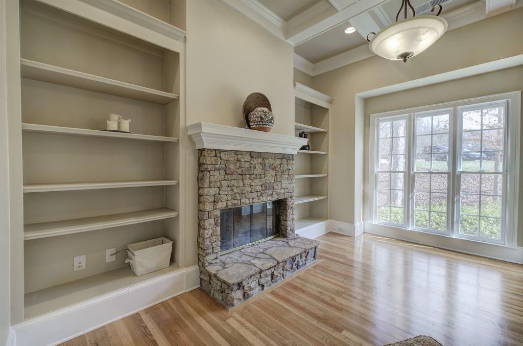 302 Waterfall Court Canton, GA 30115 - Photo 8 of 80 a living room with furniture and a fireplace