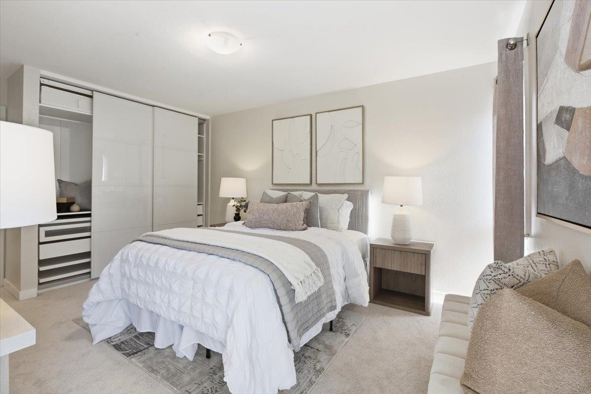 280 Easy Street, Unit 307 Mountain View, CA 94043 - Photo 24 of 30 a bedroom with a bed and a walk in closet