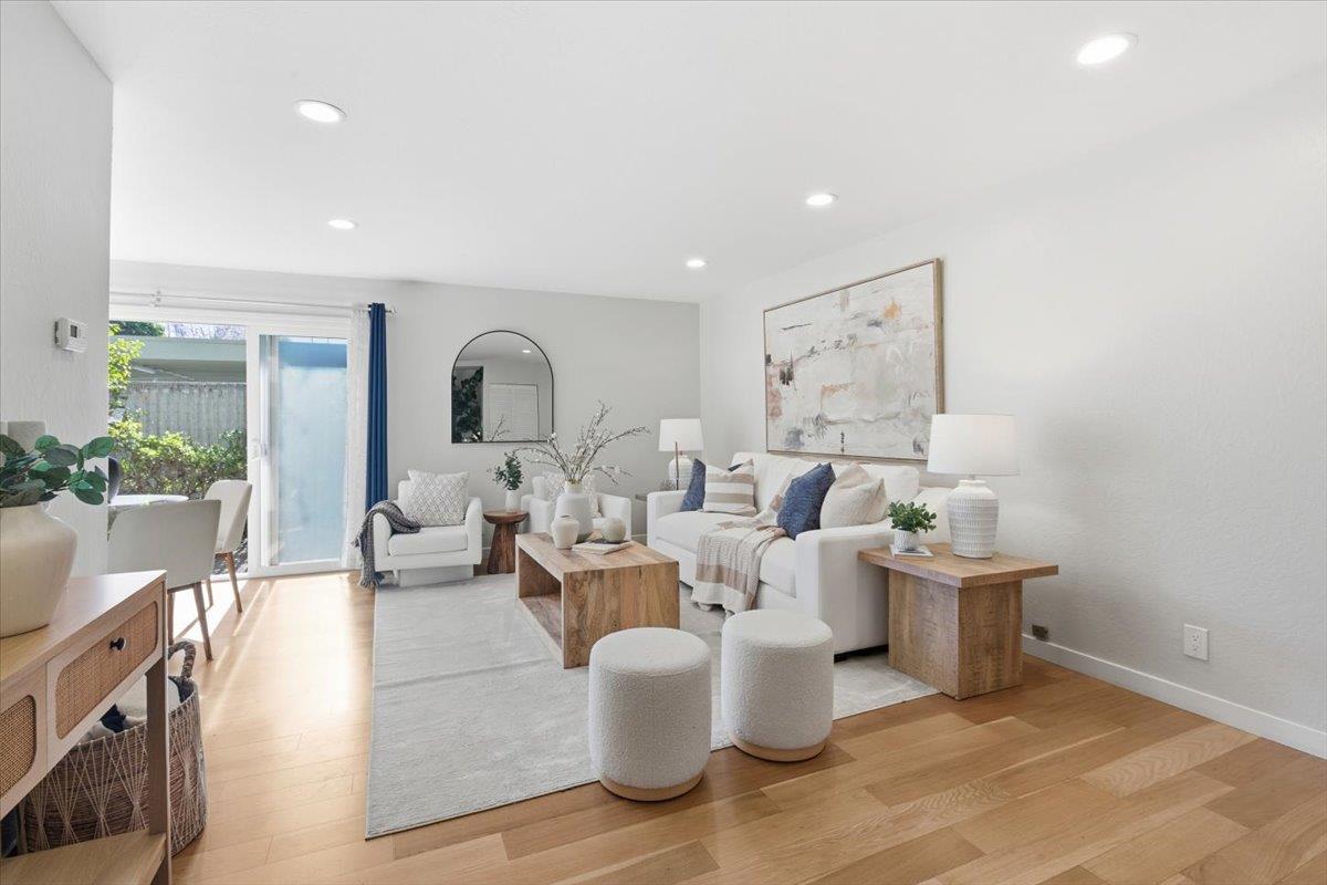 280 Easy Street, Unit 307 Mountain View, CA 94043 - Photo 6 of 30 a living room with lots of white furniture and a potted plant