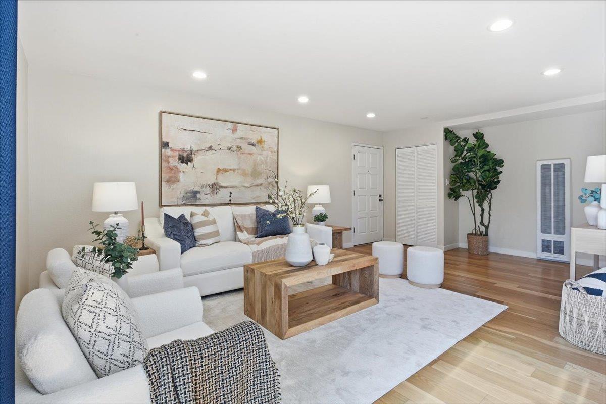 280 Easy Street, Unit 307 Mountain View, CA 94043 - Photo 7 of 30 a living room with furniture potted plant and a rug