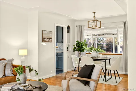 a view of a dining room with furniture window and wooden floor