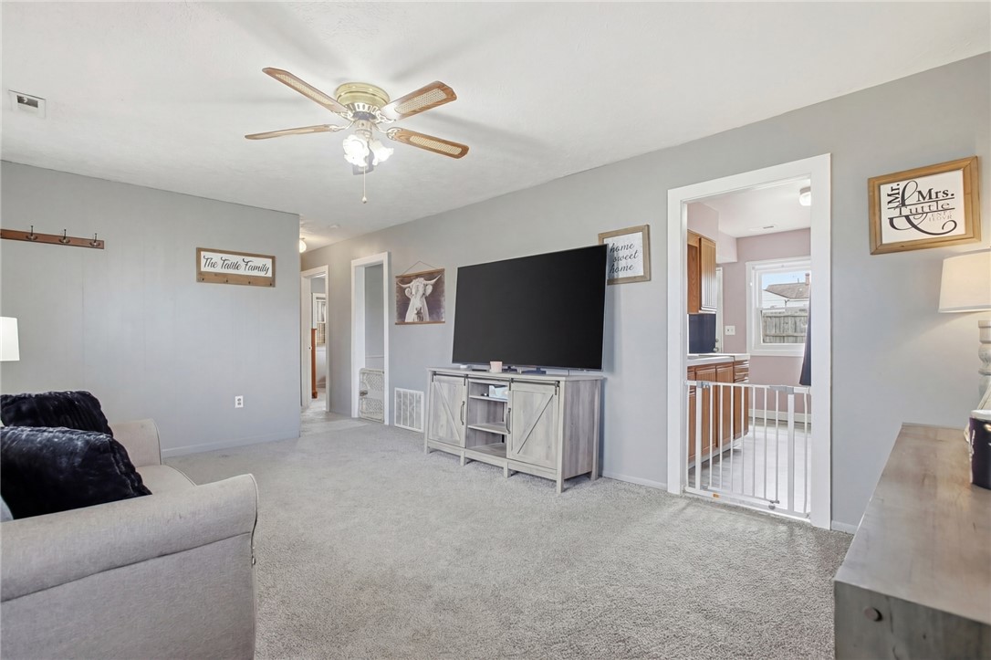 2745 Share Street Springfield, OH 45505 - Photo 7 of 28 This inviting living room offers comfort and seamless flow into adjacent spaces.