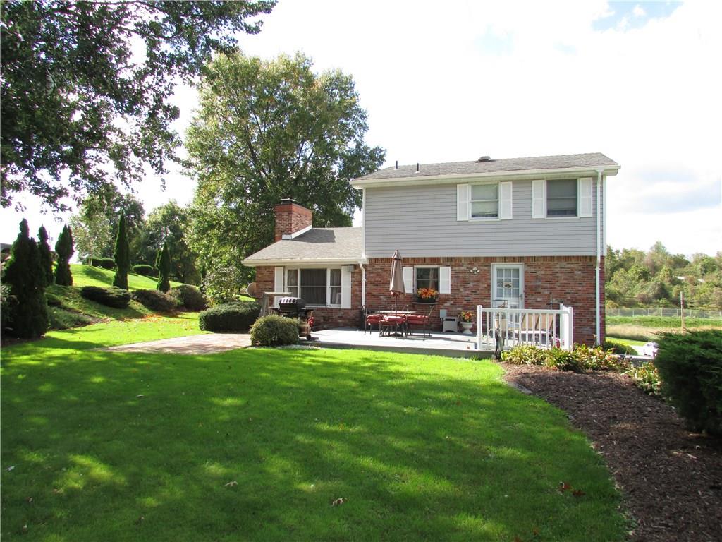4775 Williamsport Road Elizabeth, PA 15037 - Photo 4 of 25 Back of home. Beautifully landscaped yard and large patio off kitchen.