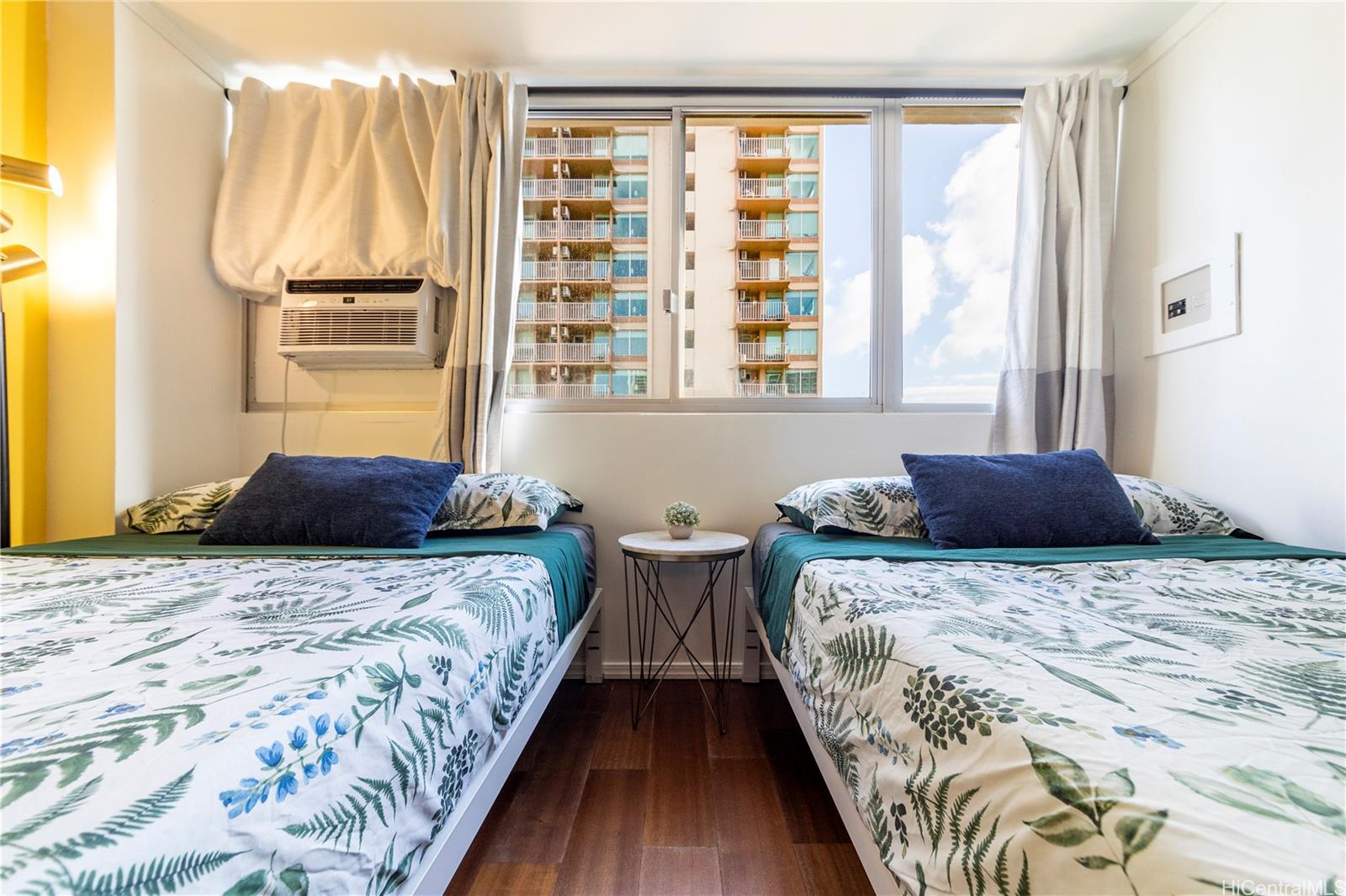 2572 Lemon Road, Unit 1105 Honolulu, HI 96815 - Photo 3 of 5 a bedroom with bed and window