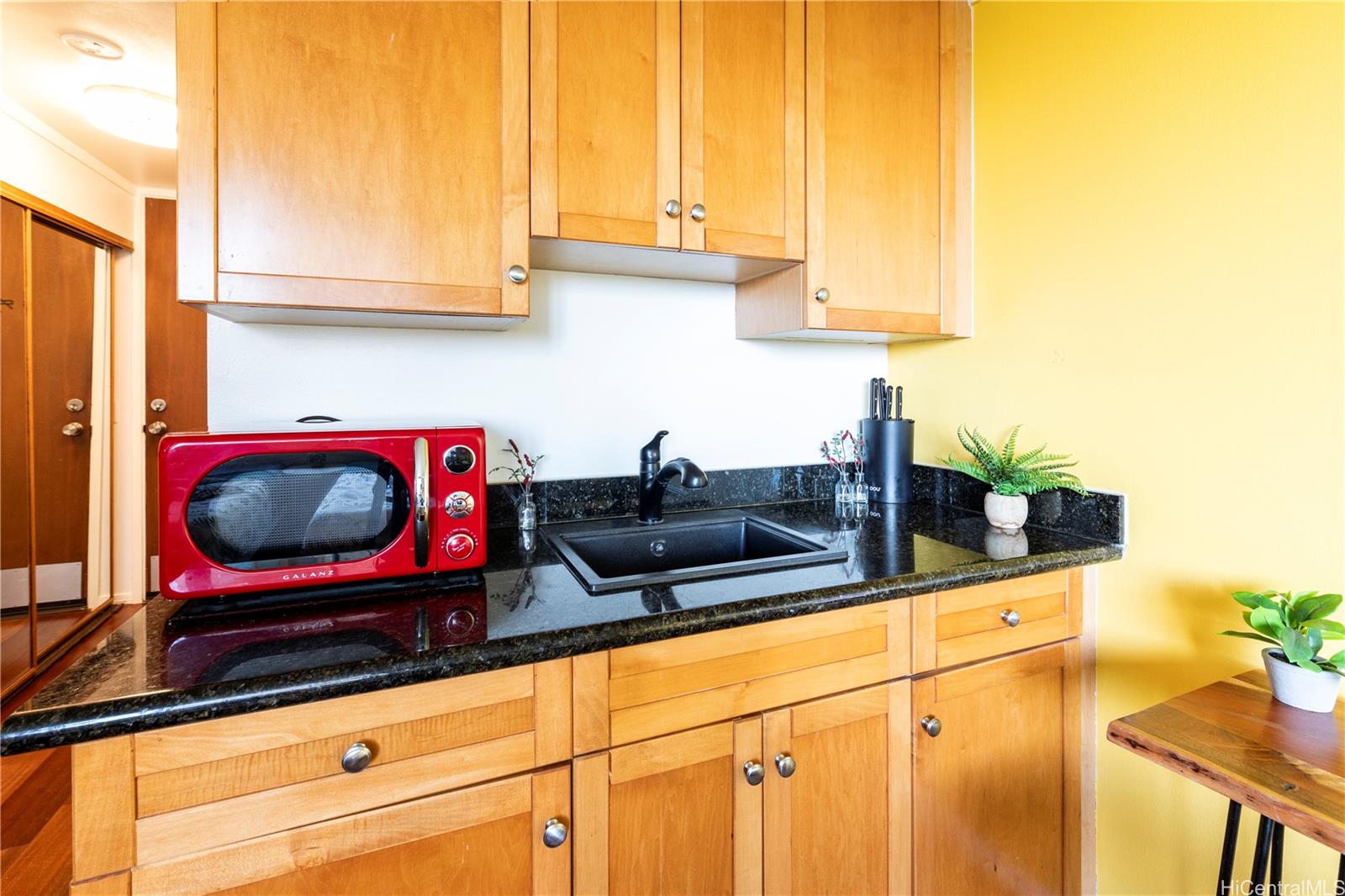 2572 Lemon Road, Unit 1105 Honolulu, HI 96815 - Photo 4 of 5 a kitchen with a sink and a stove top oven