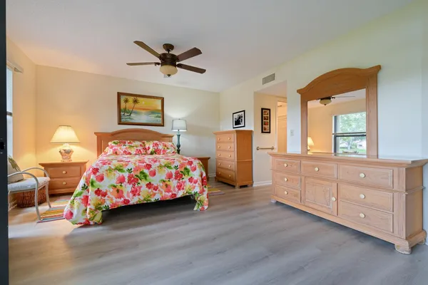a bedroom with a bed and a dresser