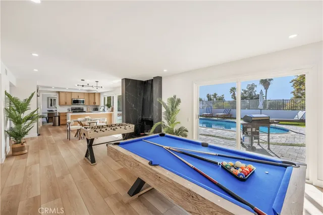 a living room with furniture a rug and a table