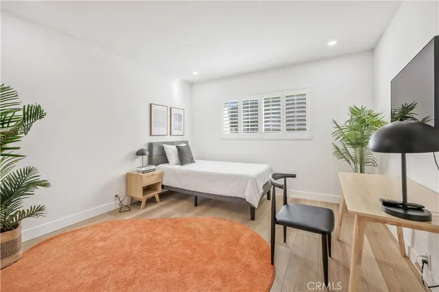 a bedroom with a bed and a table