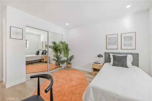 a bedroom with a bed and a chair