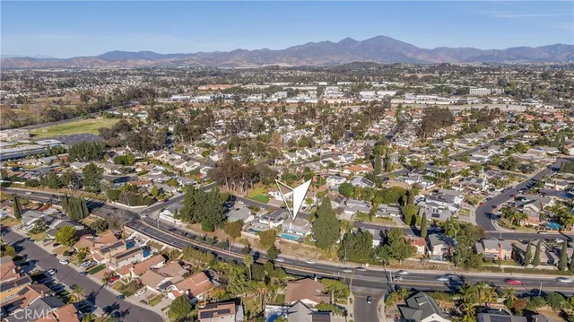 an aerial view of residential houses and outdoor space