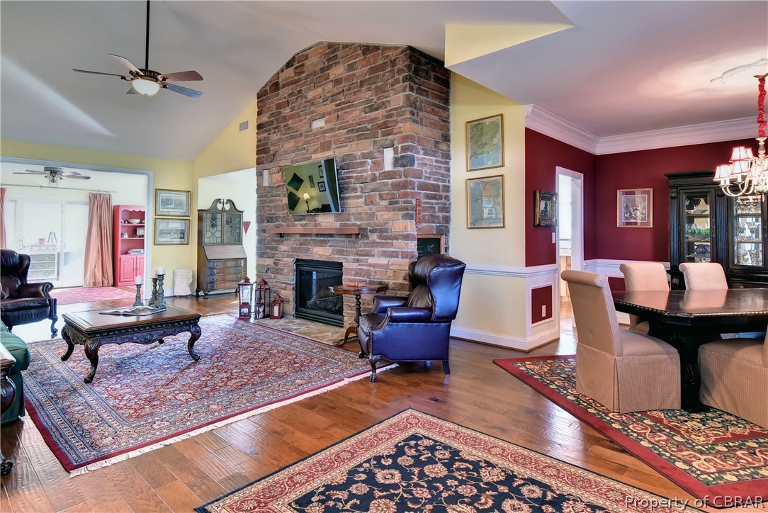 The gorgeous Great Room features a stone accent wall and opens to the elegant dining room, the sun room and breakfast nook.