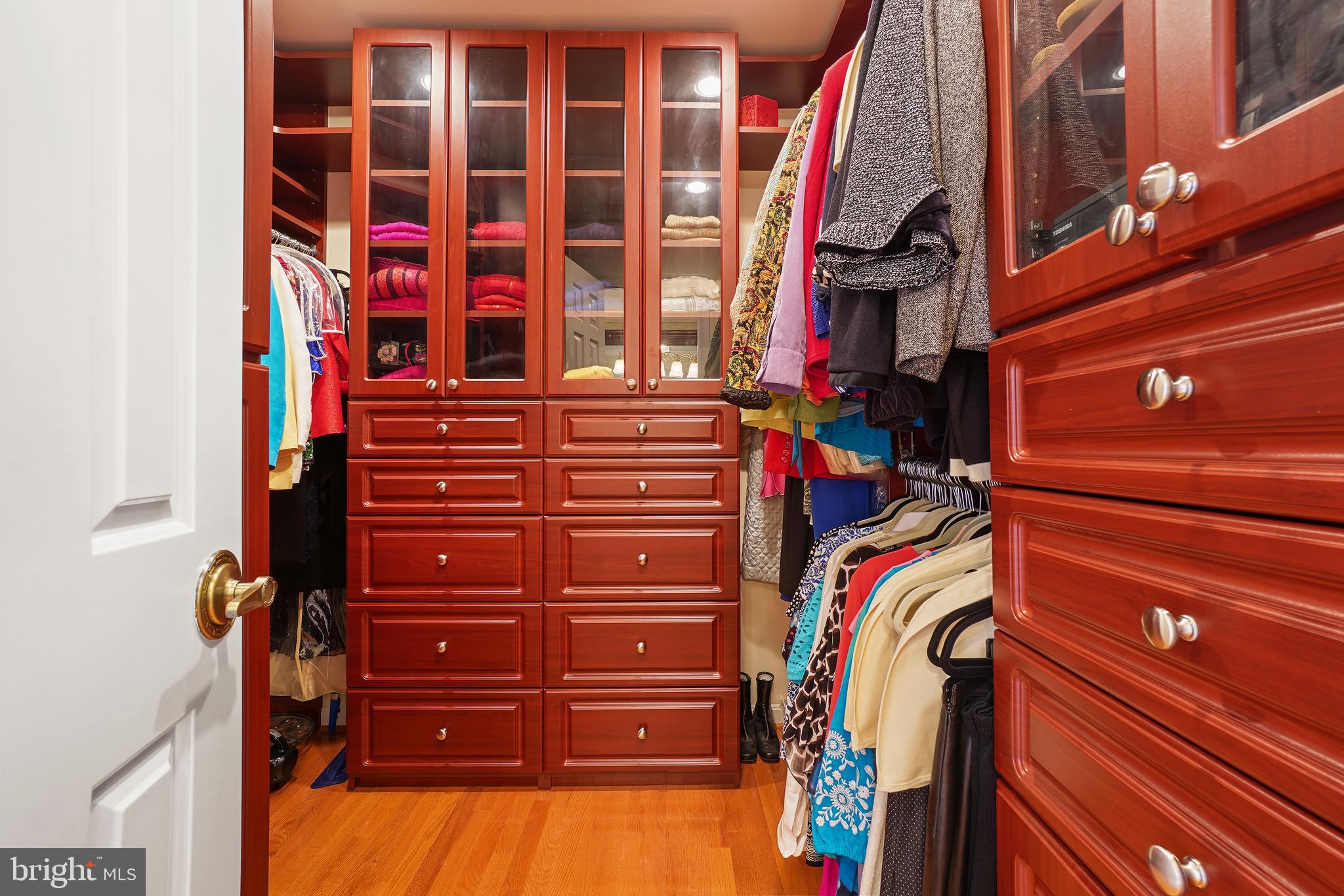 14716 Silverstone Drive Silver Spring, MD 20905 - Photo 29 of 48 Primary closet w/ custom dressers & cabinets!