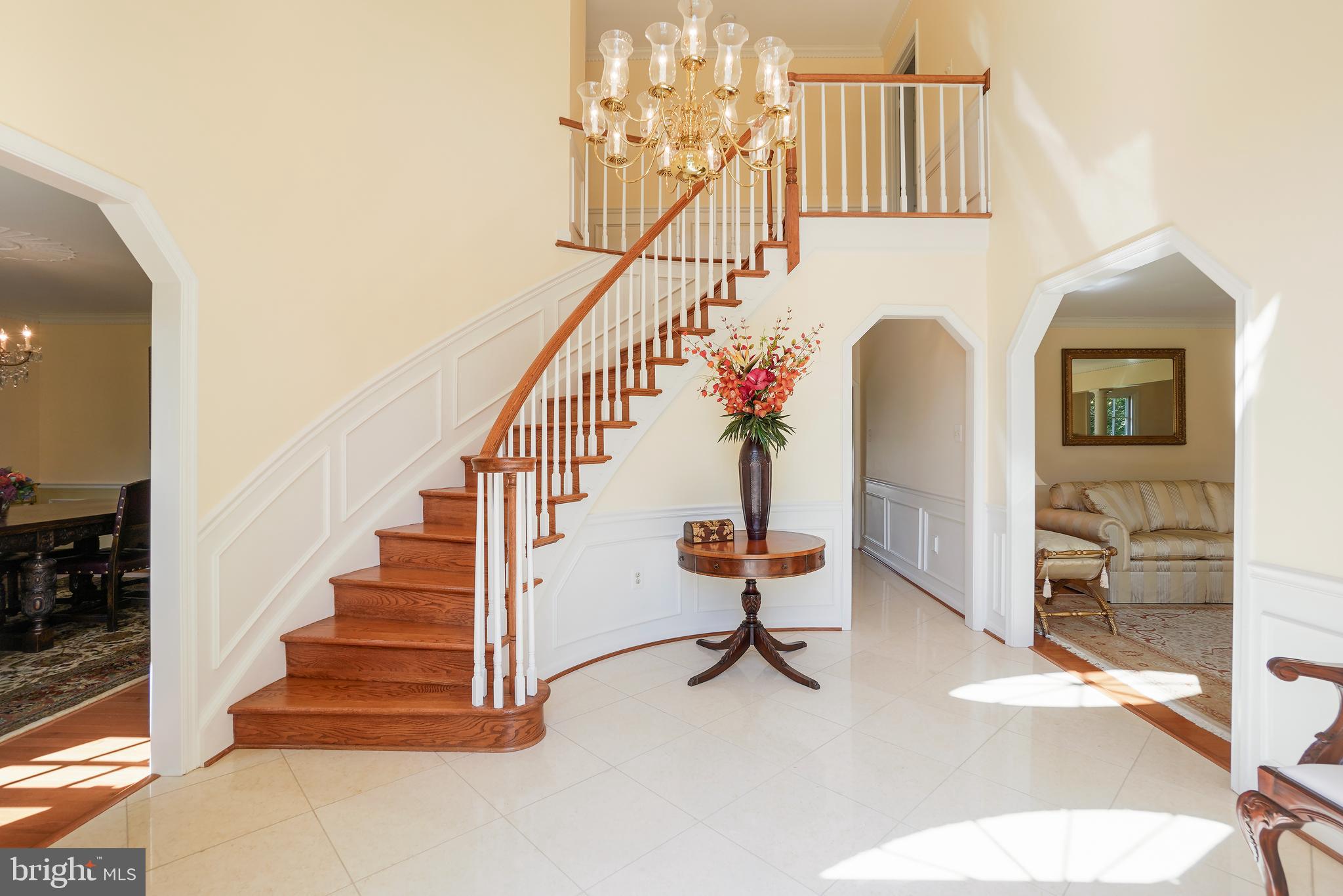 14716 Silverstone Drive Silver Spring, MD 20905 - Photo 3 of 48 Two story foyer w/ spiral staircase & marble floor