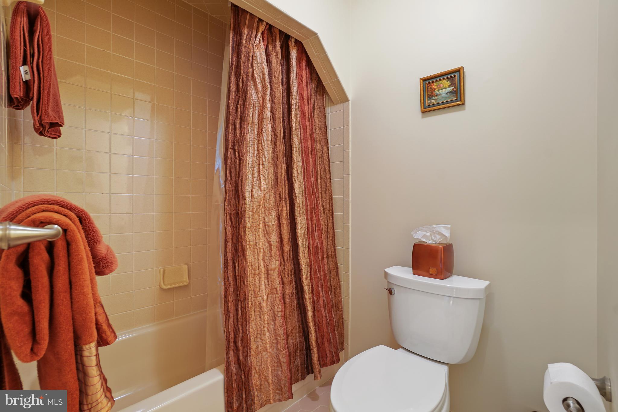 14716 Silverstone Drive Silver Spring, MD 20905 - Photo 35 of 48 Tub-shower, updated mid-rise commode.