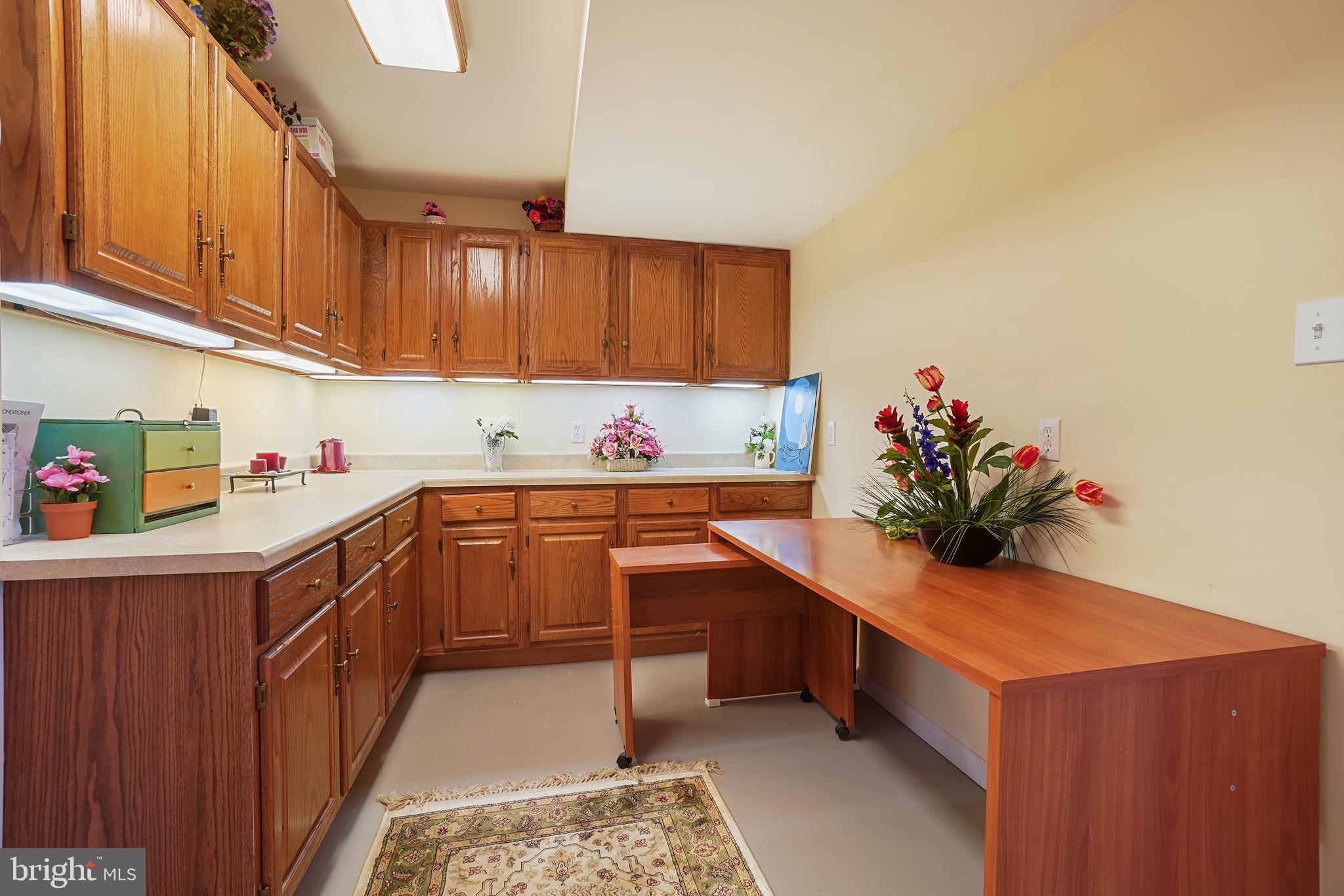 14716 Silverstone Drive Silver Spring, MD 20905 - Photo 42 of 48 Lower- level craft room with plenty of storage!