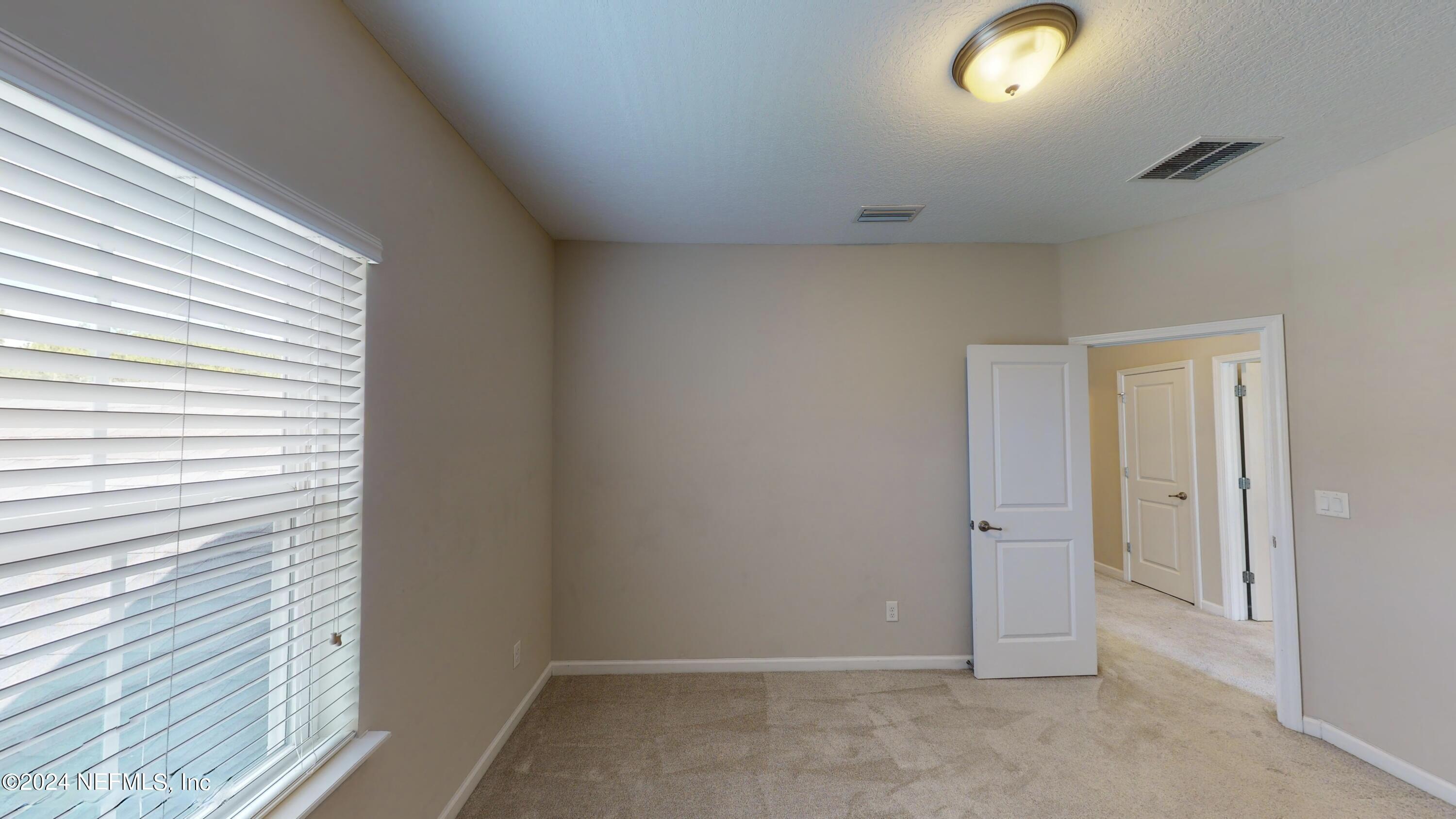 212 Concave Lane St. Augustine, FL 32095 - Photo 13 of 24 an empty room with windows